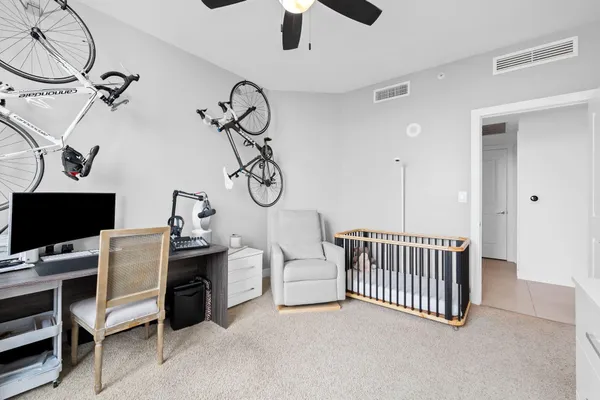 a view of a room with lots of white furniture