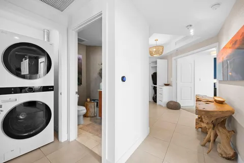 a view of a hallway with washer and dryer