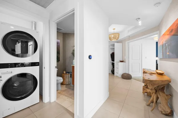 a view of a hallway with washer and dryer