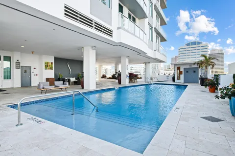 a living room with furniture and flowers