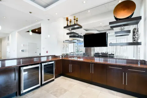 a living room with a table and chairs
