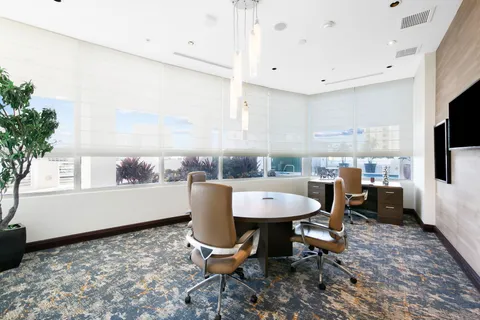 a lobby with furniture and window