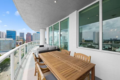 a view of a balcony with wooden floor