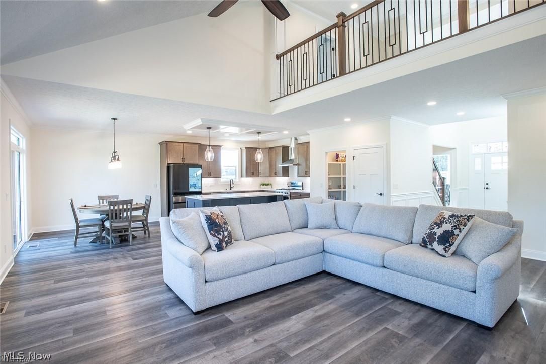 34286 Brookside Lane North Ridgeville, OH 44039 - Photo 5 of 50 Living area with high vaulted ceiling, healthy amount of natural light, dark wood-style flooring, recessed lighting, and ceiling fan