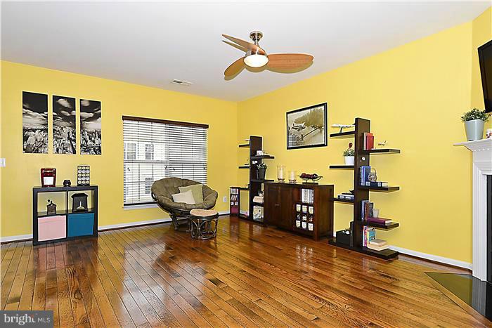 22751 Verde Gate Terrace Ashburn, VA 20148 - Photo 12 of 29 a view of a workspace with furniture and wooden floor