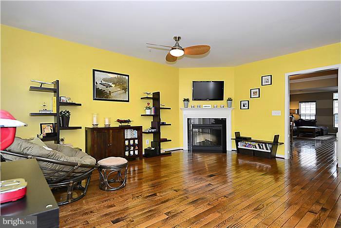 22751 Verde Gate Terrace Ashburn, VA 20148 - Photo 13 of 29 a living room with furniture and a flat screen tv