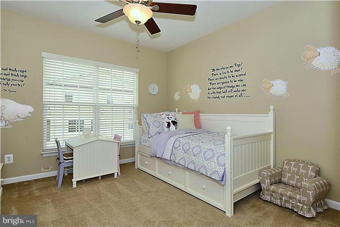22751 Verde Gate Terrace Ashburn, VA 20148 - Photo 15 of 29 a bedroom with a bed and a window