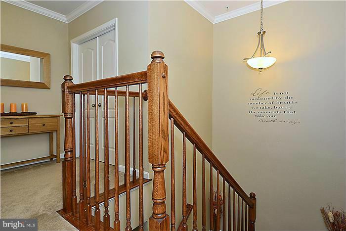 22751 Verde Gate Terrace Ashburn, VA 20148 - Photo 26 of 29 a view of a hallway with entryway and stairs