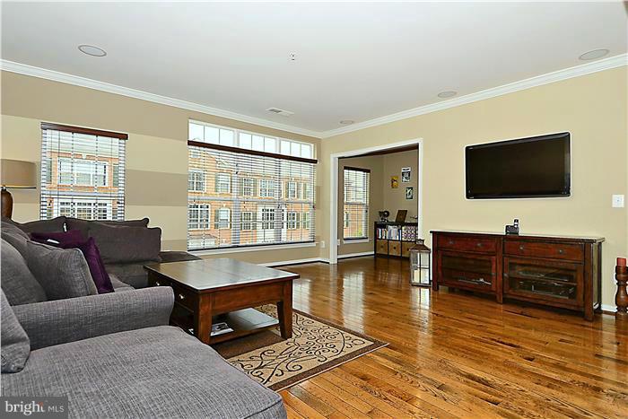 22751 Verde Gate Terrace Ashburn, VA 20148 - Photo 4 of 29 a living room with furniture and a flat screen tv