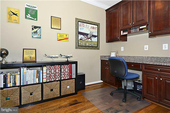 22751 Verde Gate Terrace Ashburn, VA 20148 - Photo 10 of 29 a view of a workspace with furniture and toys