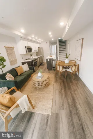 a view of a living room filled with furniture