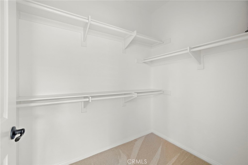 90 Galan Street Rancho Mission Viejo, CA 92694 - Photo 16 of 67 a view of a room with racks on the wall