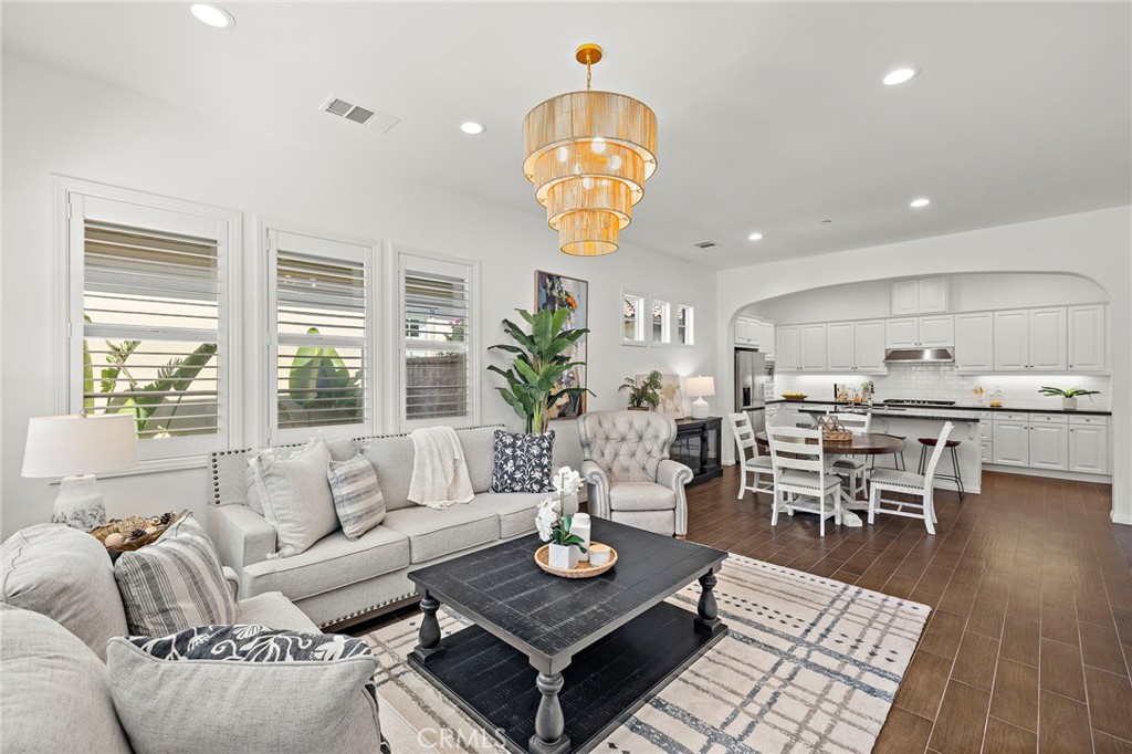 90 Galan Street Rancho Mission Viejo, CA 92694 - Photo 2 of 67 a living room with lots of furniture and a table