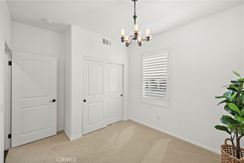 90 Galan Street Rancho Mission Viejo, CA 92694 - Photo 21 of 67 a view of an empty room with a window