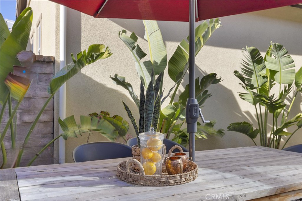 90 Galan Street Rancho Mission Viejo, CA 92694 - Photo 27 of 67 a vase of flowers sitting on a table with wooden floor