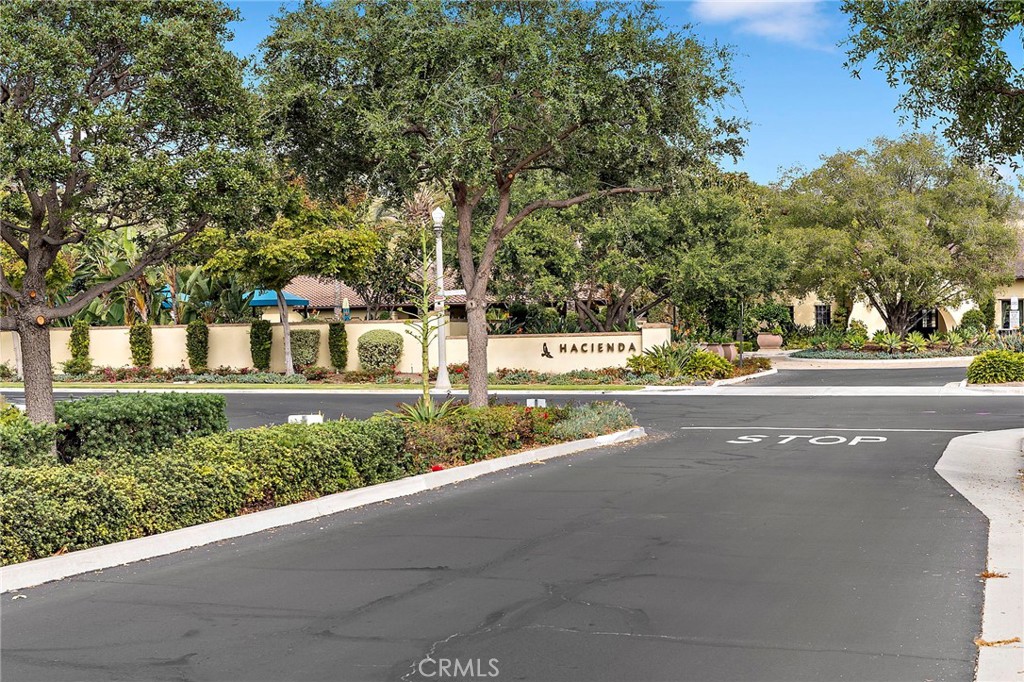 90 Galan Street Rancho Mission Viejo, CA 92694 - Photo 34 of 67 a front view of a building with a yard and trees