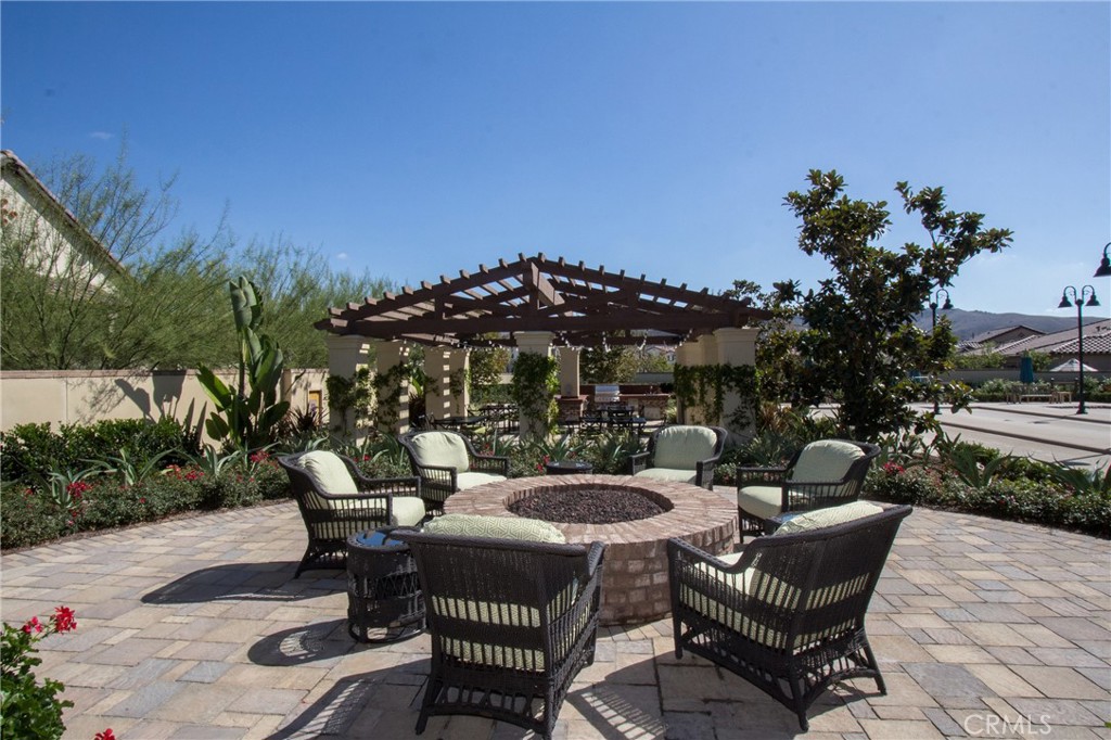 90 Galan Street Rancho Mission Viejo, CA 92694 - Photo 44 of 67 a view of a patio with couches table and chairs and potted plants