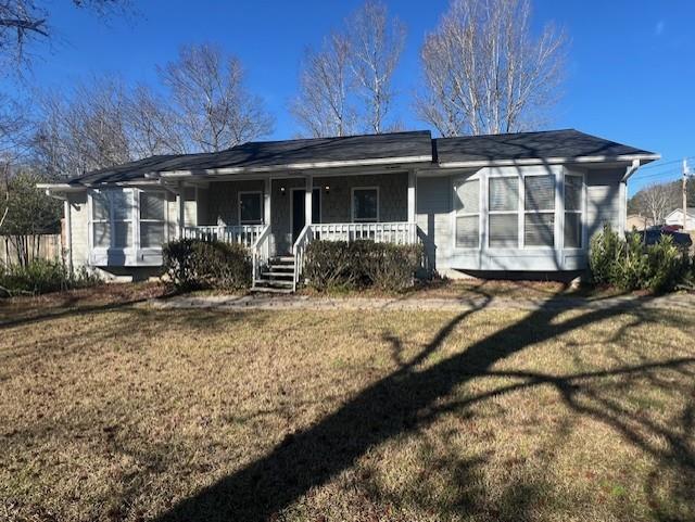 a front view of a house with sitting area