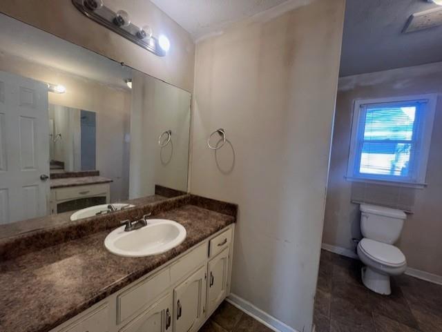60 Timber Mill Circle Carrollton, GA 30116 - Photo 9 of 14 a bathroom with a granite countertop sink a toilet and a mirror