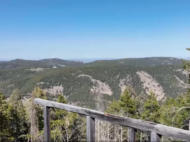 a view of a mountain from a balcony