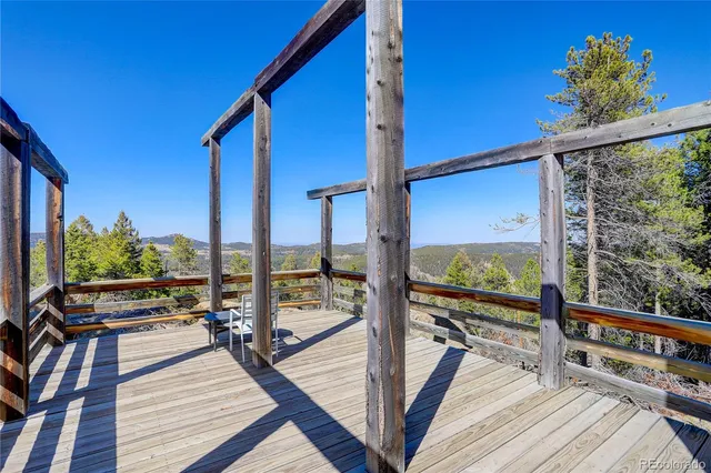 a view of balcony with floor to ceiling windows with wooden floor