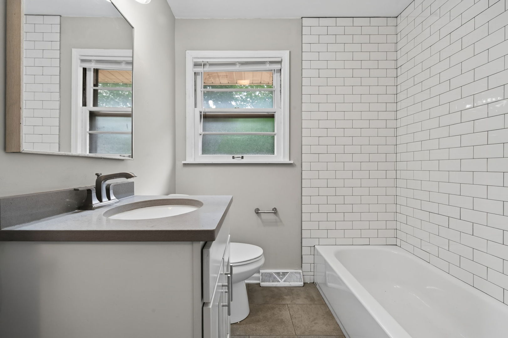 415 Alma Terrace Cary, IL 60013 - Photo 14 of 23 a bathroom with a granite countertop sink toilet and shower