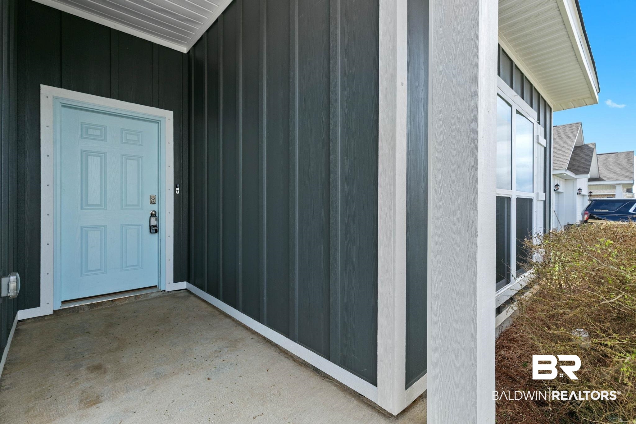 9448 Amethyst Drive Daphne, AL 36526 - Photo 7 of 61 View of exterior entry with board and batten siding