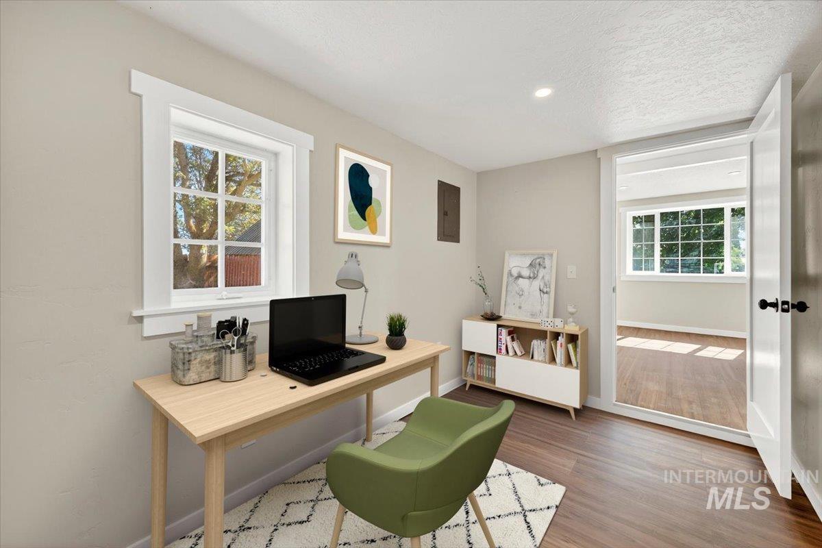 109 Parma Road Parma, ID 83660 - Photo 21 of 31 Office/guest room featuring luxury plank flooring, recessed lighting, a window with white trim, W/D hookup and a new water heater
