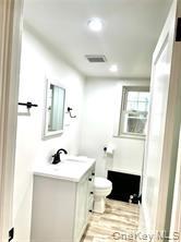 48 Lincoln Street New Rochelle, NY 10801 - Photo 8 of 9 Bathroom featuring vanity, toilet, and recessed lighting