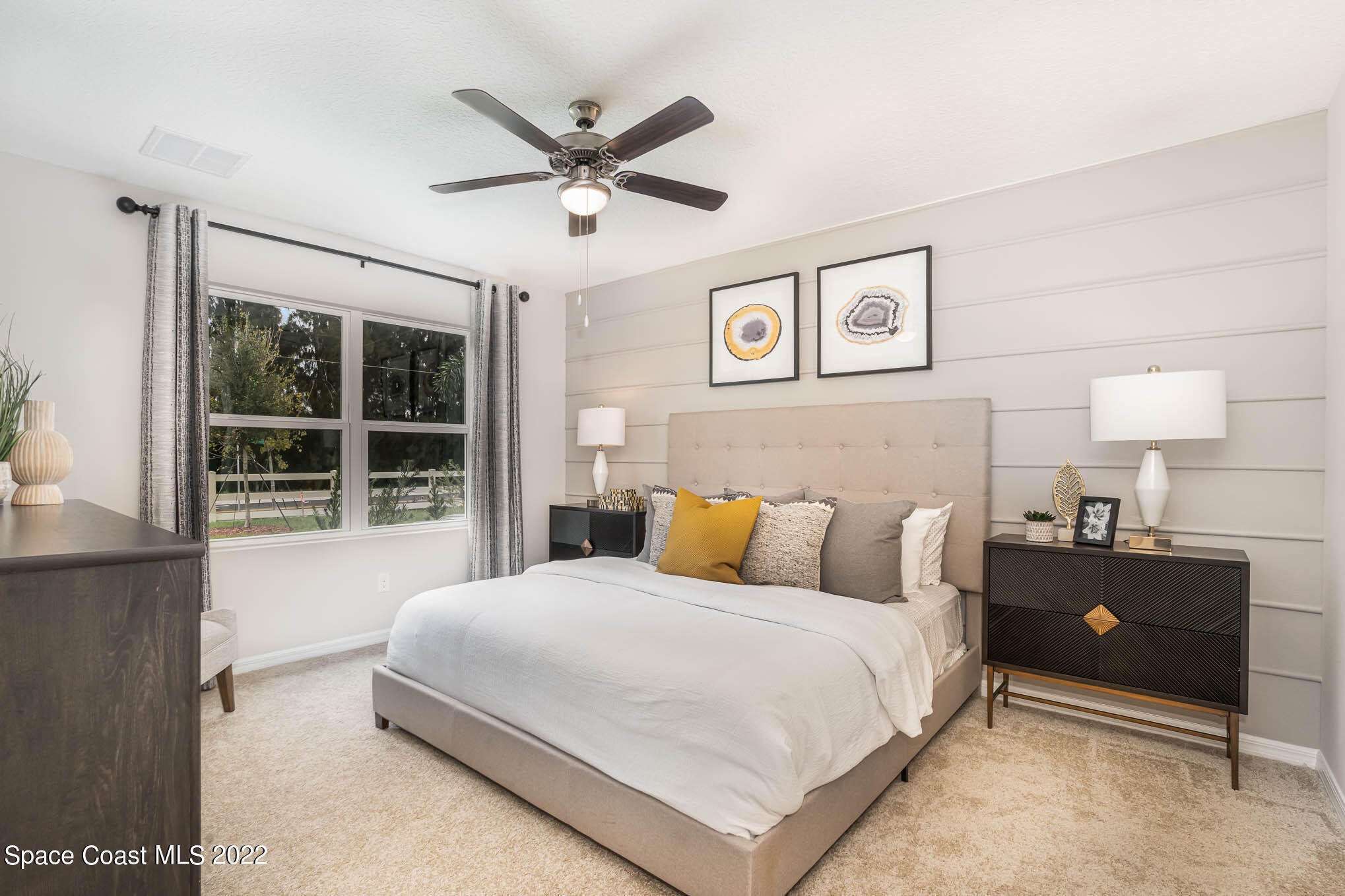1058 Trinity Street Rockledge, FL 32955 - Photo 16 of 30 a bedroom with a bed and a large window