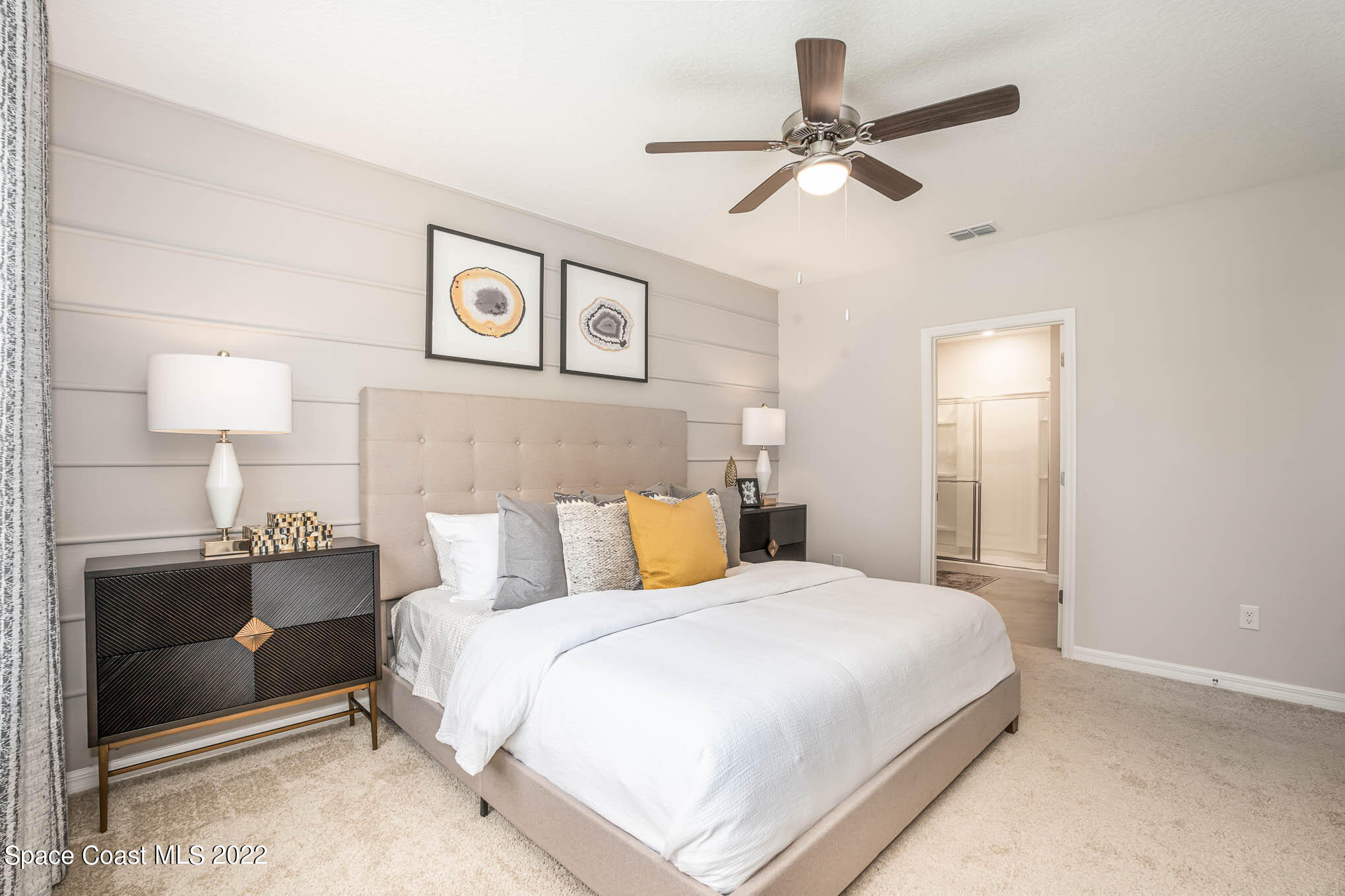 1058 Trinity Street Rockledge, FL 32955 - Photo 18 of 30 a bedroom with a bed and dresser