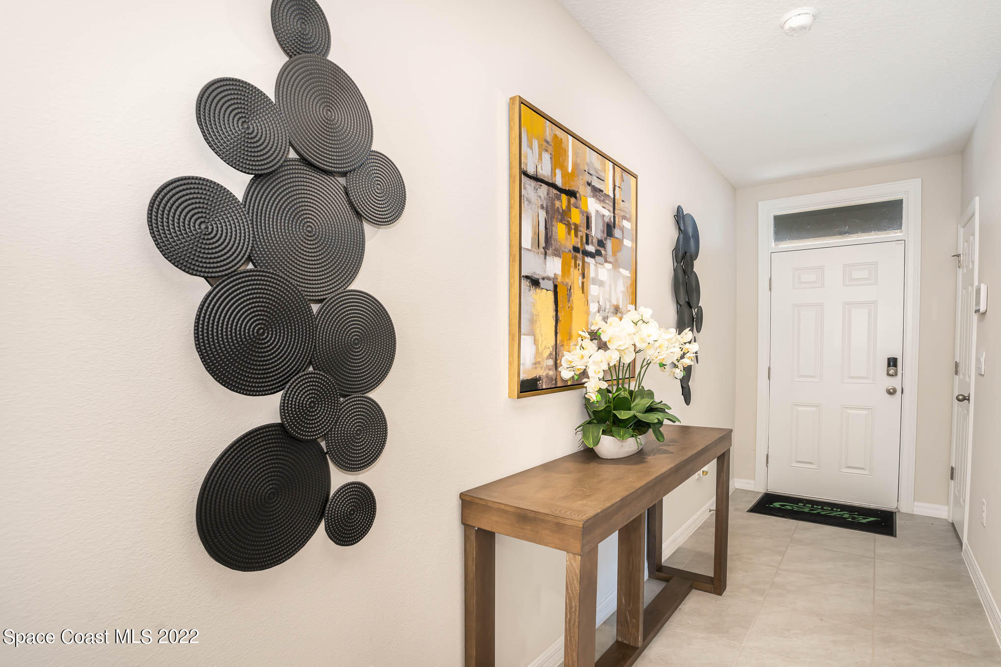 1058 Trinity Street Rockledge, FL 32955 - Photo 2 of 30 a bathroom with a sink and a mirror