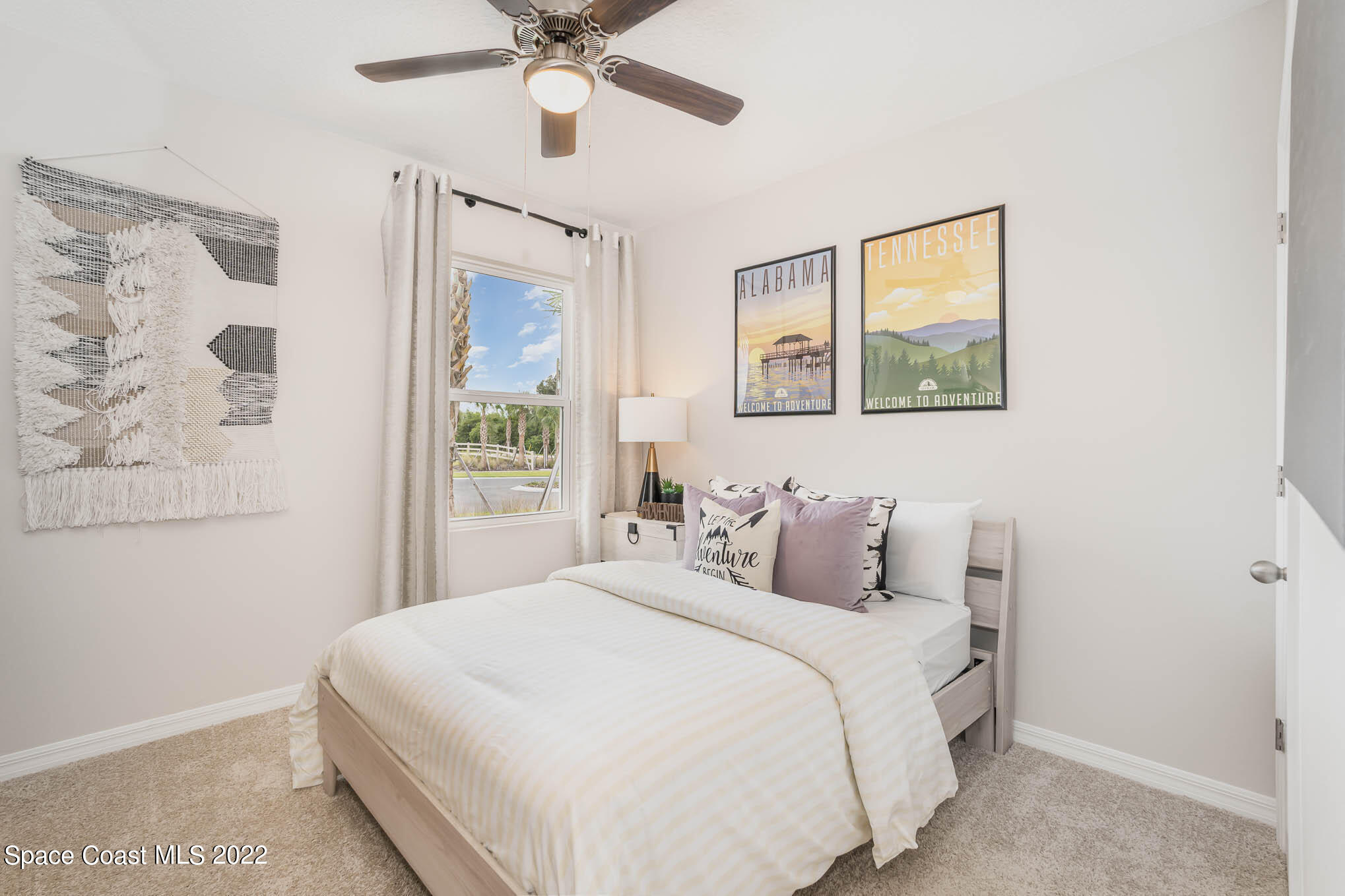 1058 Trinity Street Rockledge, FL 32955 - Photo 5 of 30 a bedroom with a large bed and a window