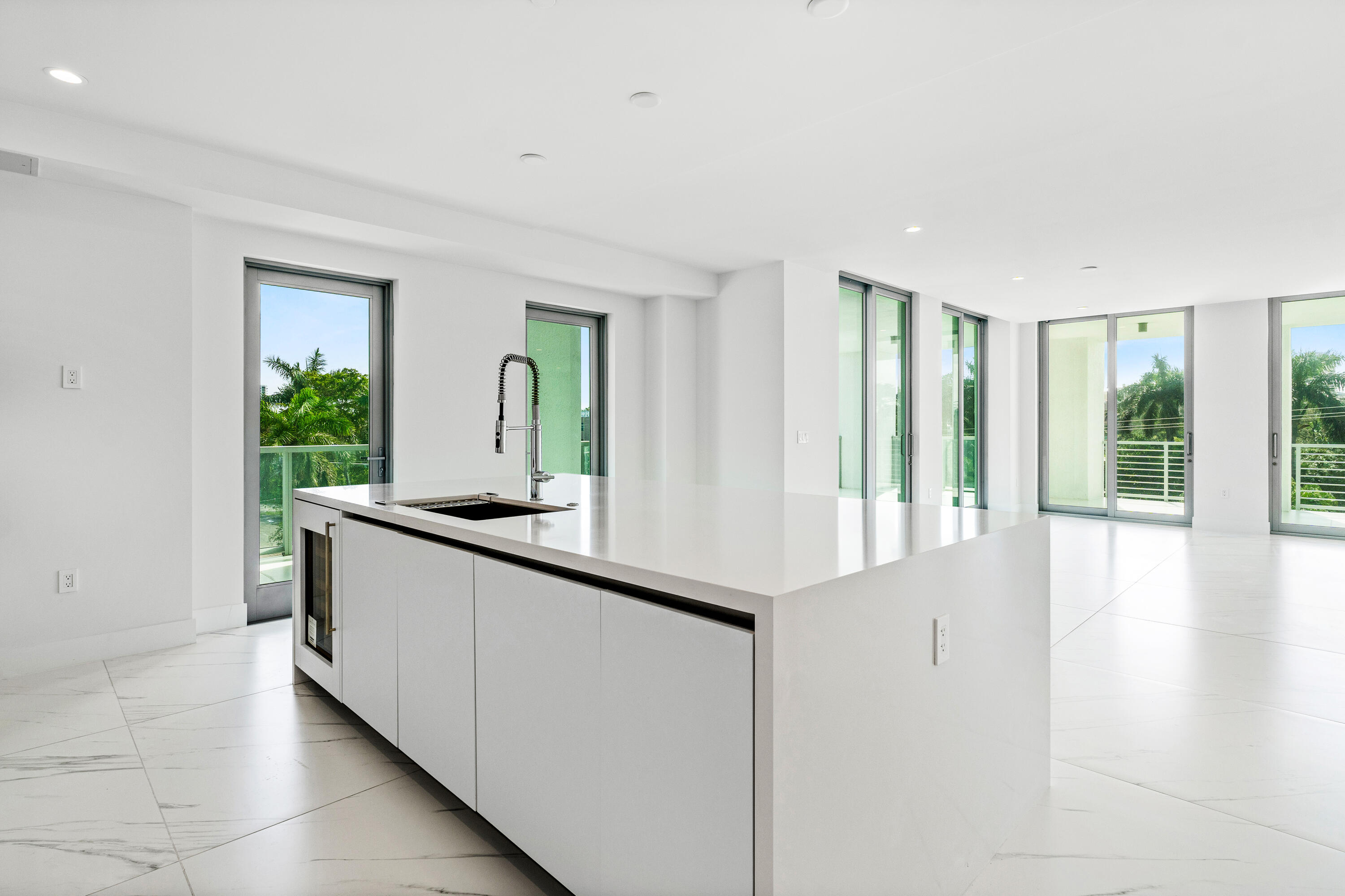 495 East Royal Palm Road, Unit 402 Boca Raton, FL 33432 - Photo 13 of 63 a large white kitchen with granite countertop a large window