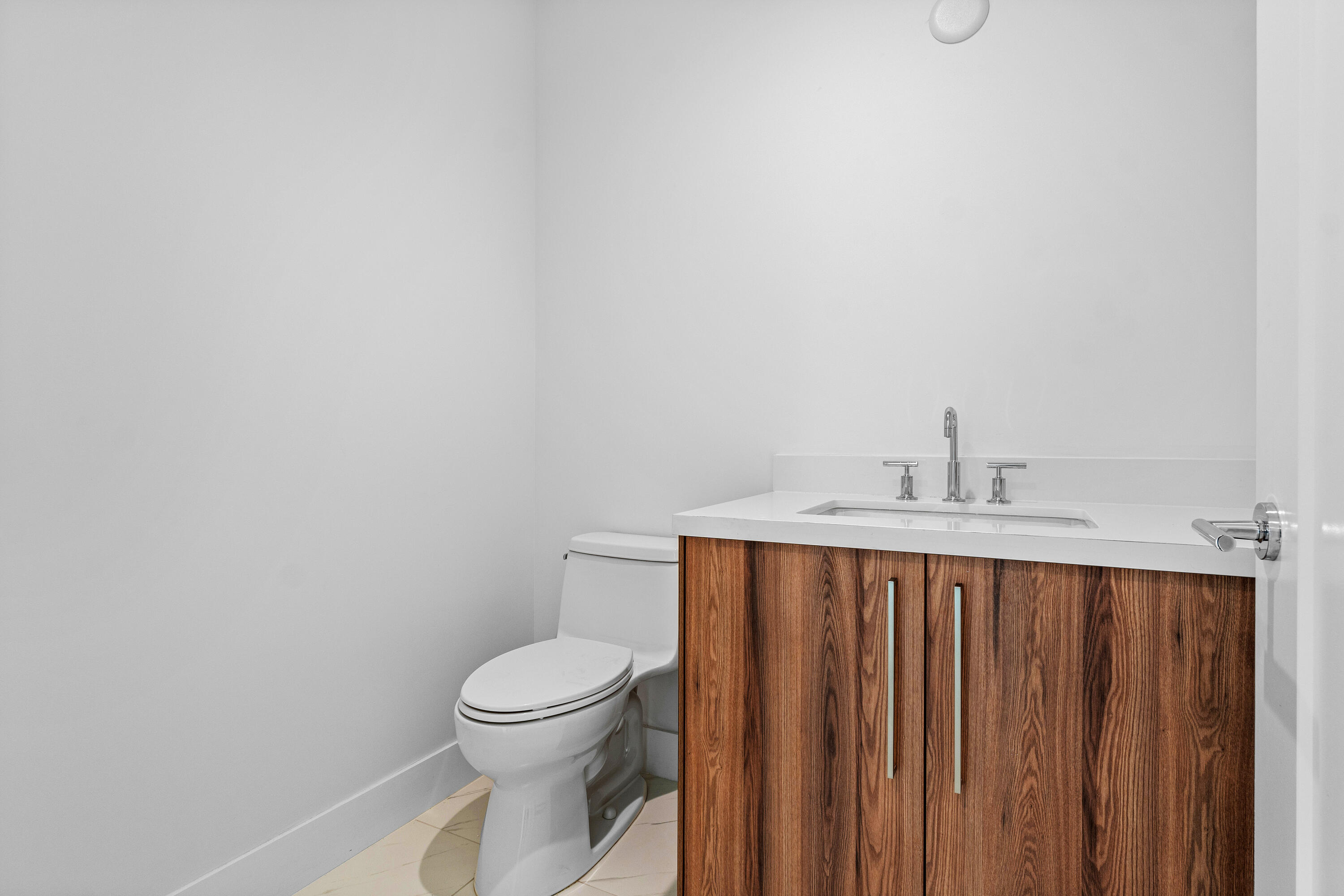 495 East Royal Palm Road, Unit 402 Boca Raton, FL 33432 - Photo 15 of 63 a bathroom with a toilet a sink and a window