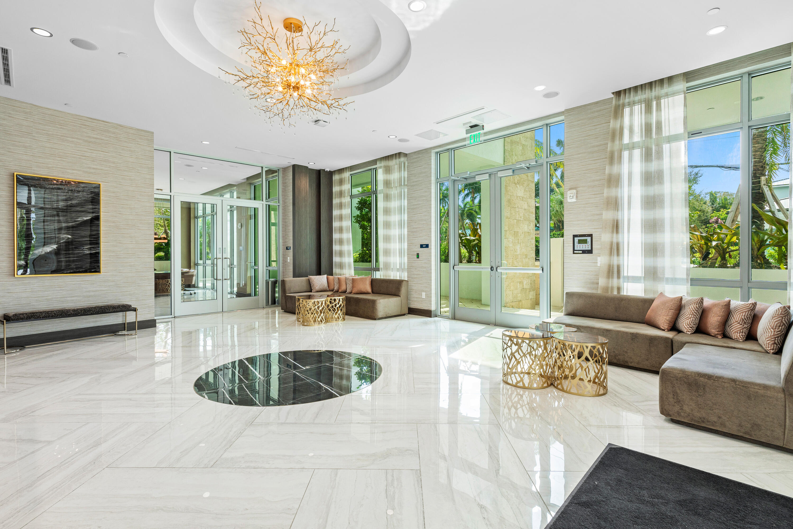 495 East Royal Palm Road, Unit 402 Boca Raton, FL 33432 - Photo 42 of 63 a living room with furniture chandelier and large windows