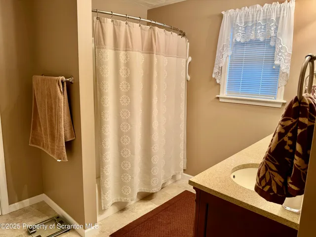 a view of a balcony with wooden floor and stairs