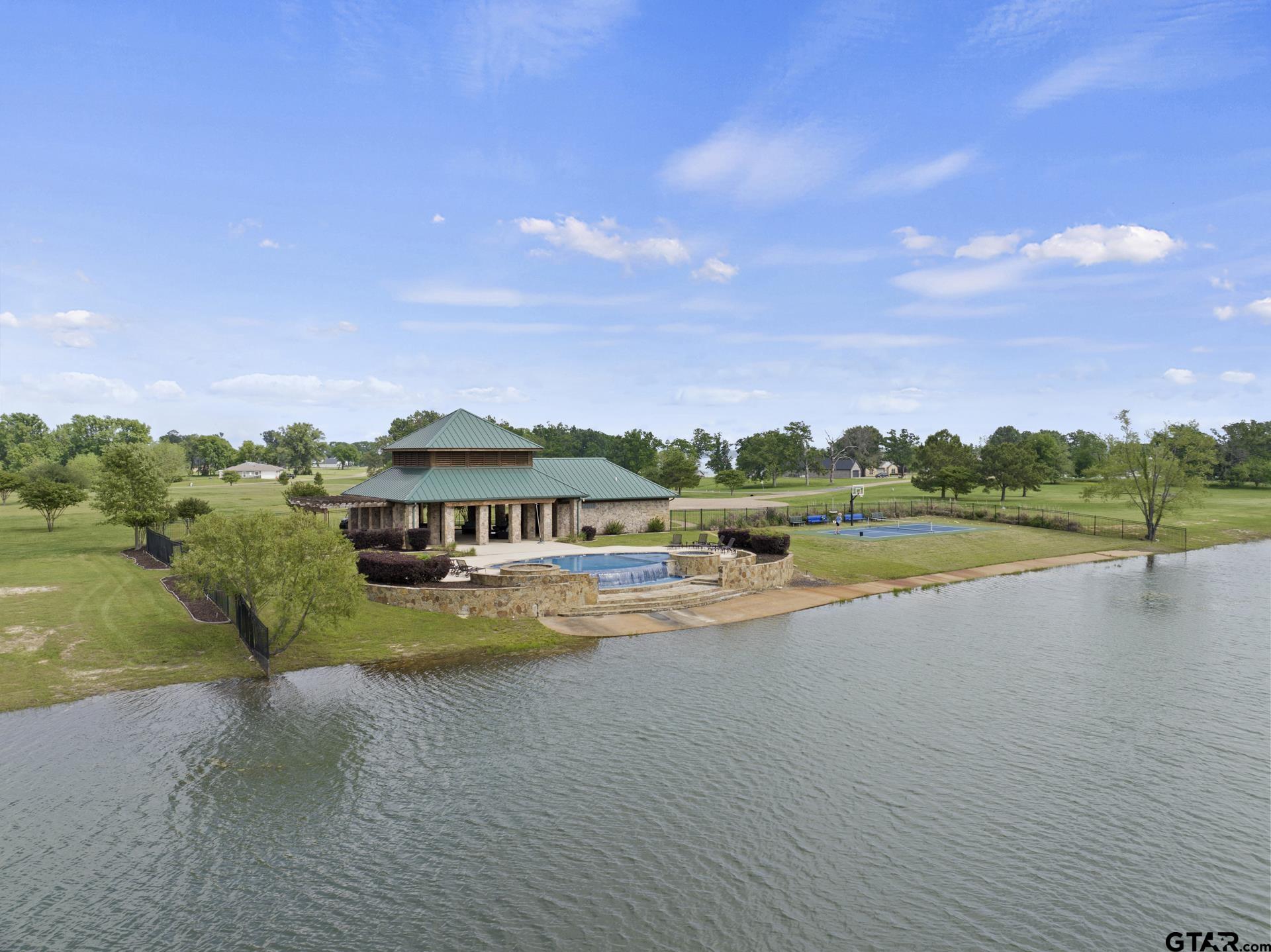 232 PR 2712 Mount Pleasant, TX 75455 - Photo 14 of 23 a view of a lake with houses in the back