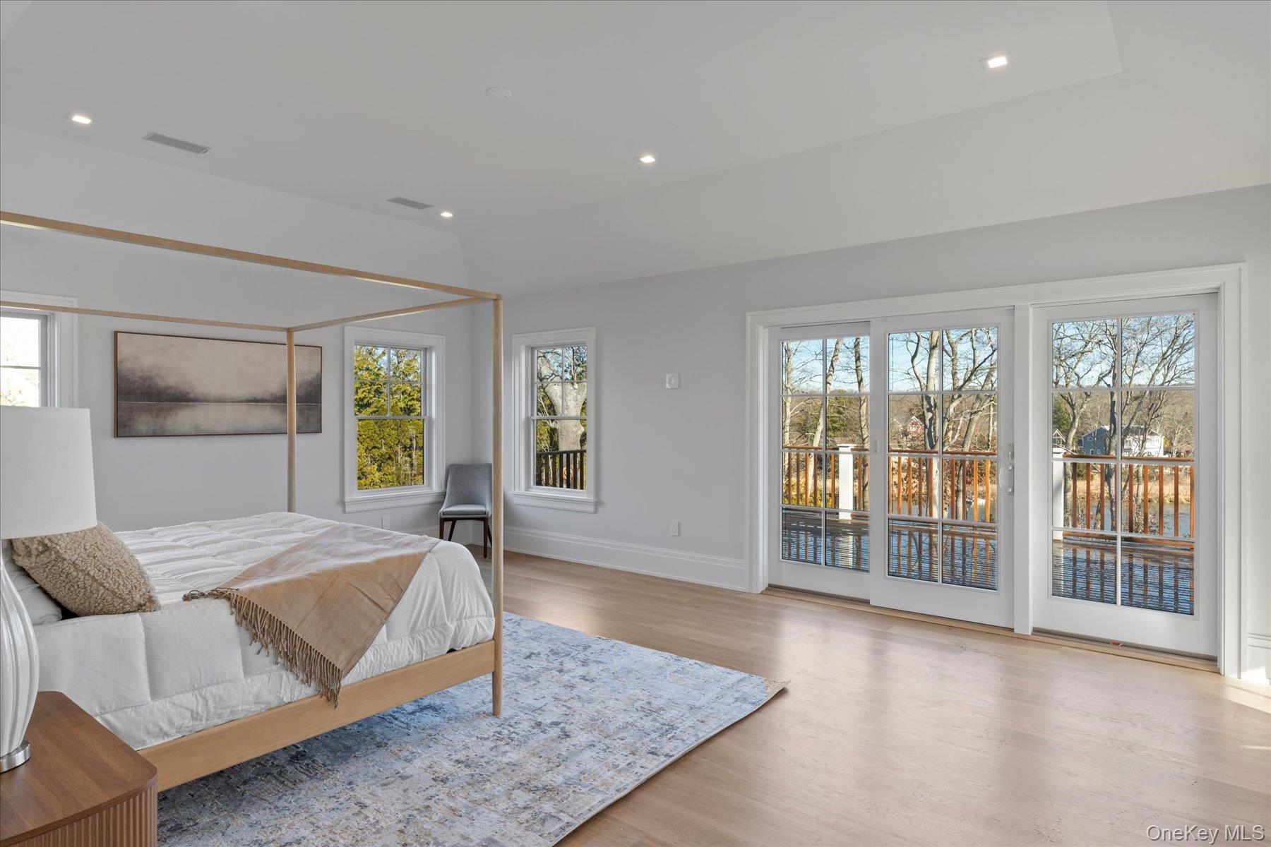 2590 Cox Neck Road Mattituck, NY 11952 - Photo 25 of 50 A serene waterfront primary retreat offering private terrace access, expansive views and a tranquil ambiance