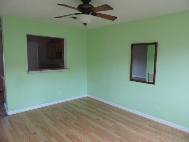 710 Legion Drive, Unit O2 Destin, FL 32541 - Photo 4 of 12 a view of a room that has a window and wooden floor