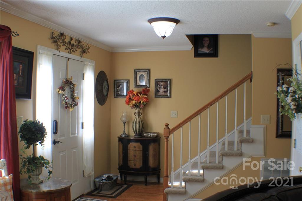 128 Cameron Drive Rutherfordton, NC 28139 - Photo 2 of 48 a view of a hallway with wooden floor and stairs