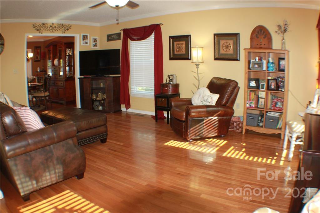 128 Cameron Drive Rutherfordton, NC 28139 - Photo 3 of 48 a living room with furniture cabinets and a flat screen tv