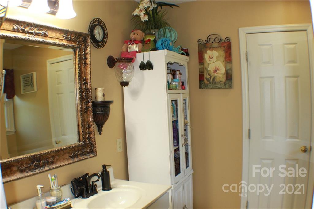 128 Cameron Drive Rutherfordton, NC 28139 - Photo 21 of 48 a bathroom with a sink and mirror