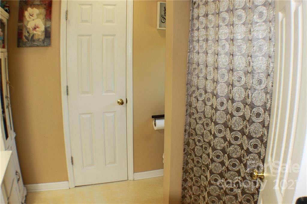 128 Cameron Drive Rutherfordton, NC 28139 - Photo 22 of 48 a bathroom with a shower curtain