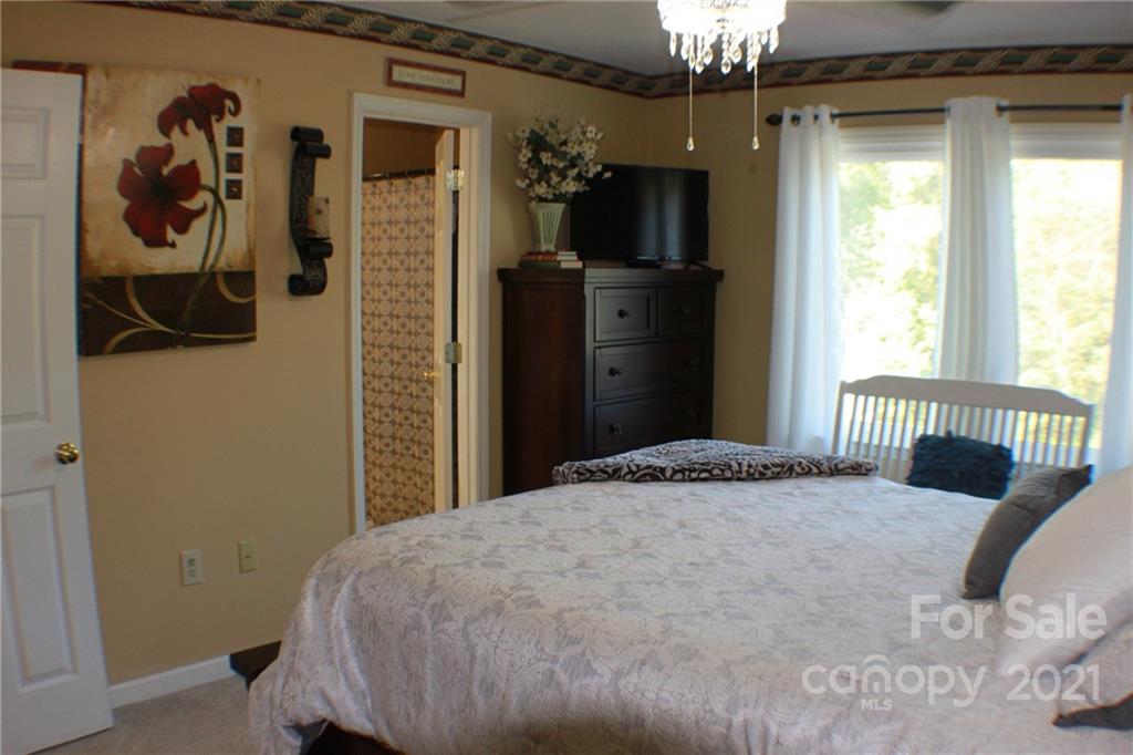128 Cameron Drive Rutherfordton, NC 28139 - Photo 23 of 48 a bedroom with a bed and a window
