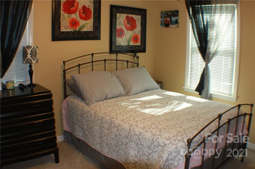 128 Cameron Drive Rutherfordton, NC 28139 - Photo 24 of 48 a bedroom with a bed and wooden floor