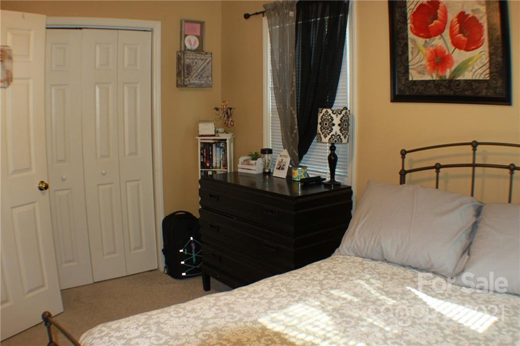 128 Cameron Drive Rutherfordton, NC 28139 - Photo 25 of 48 a bedroom with a bed and a mirror