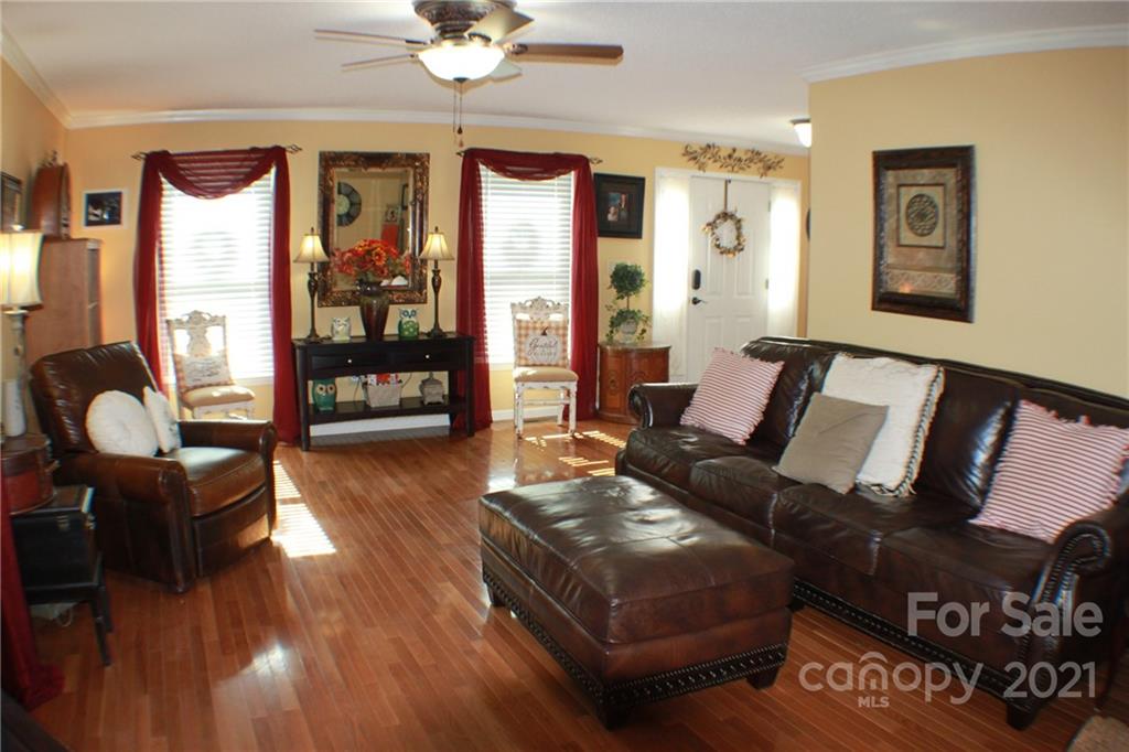 128 Cameron Drive Rutherfordton, NC 28139 - Photo 4 of 48 a living room with furniture and wooden floor