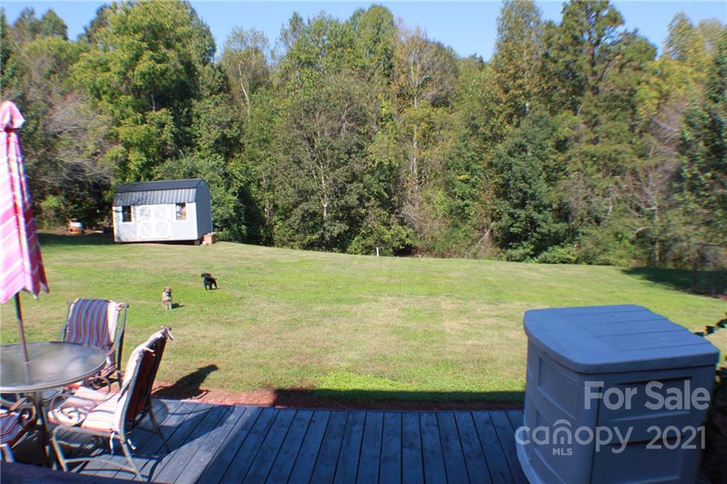 128 Cameron Drive Rutherfordton, NC 28139 - Photo 32 of 48 a view of a swimming pool with lawn chairs under an umbrella