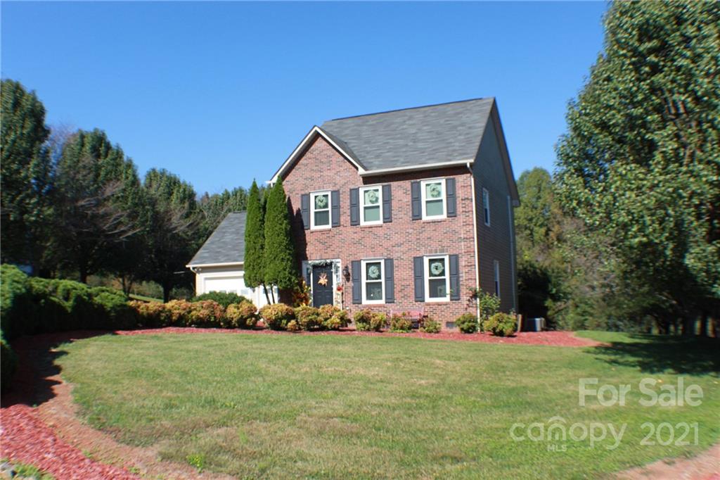 128 Cameron Drive Rutherfordton, NC 28139 - Photo 39 of 48 a front view of a house with garden
